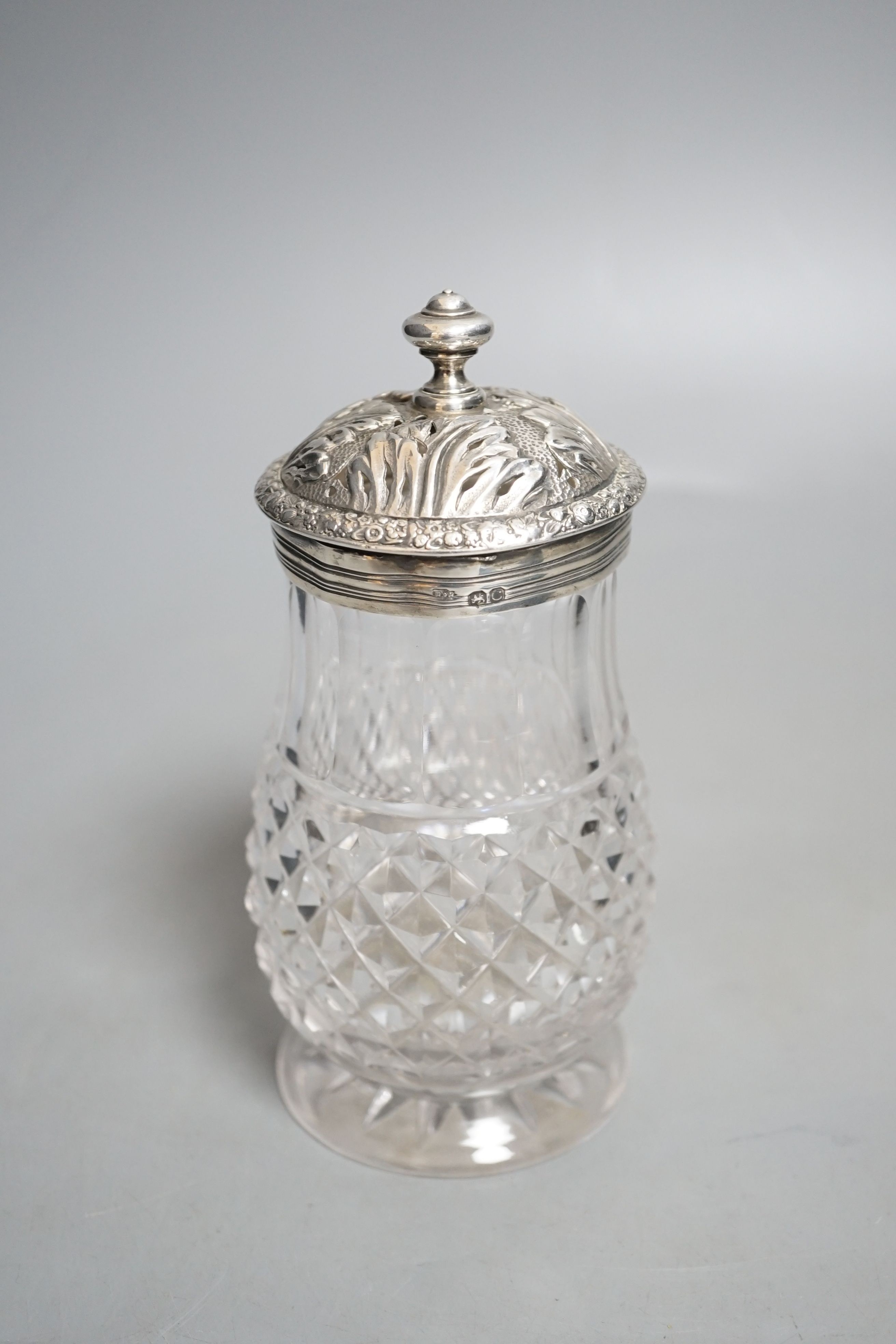A late George III silver mounted cut glass caster, Edward Farrell, London, 1818, height 16.2cm (split).